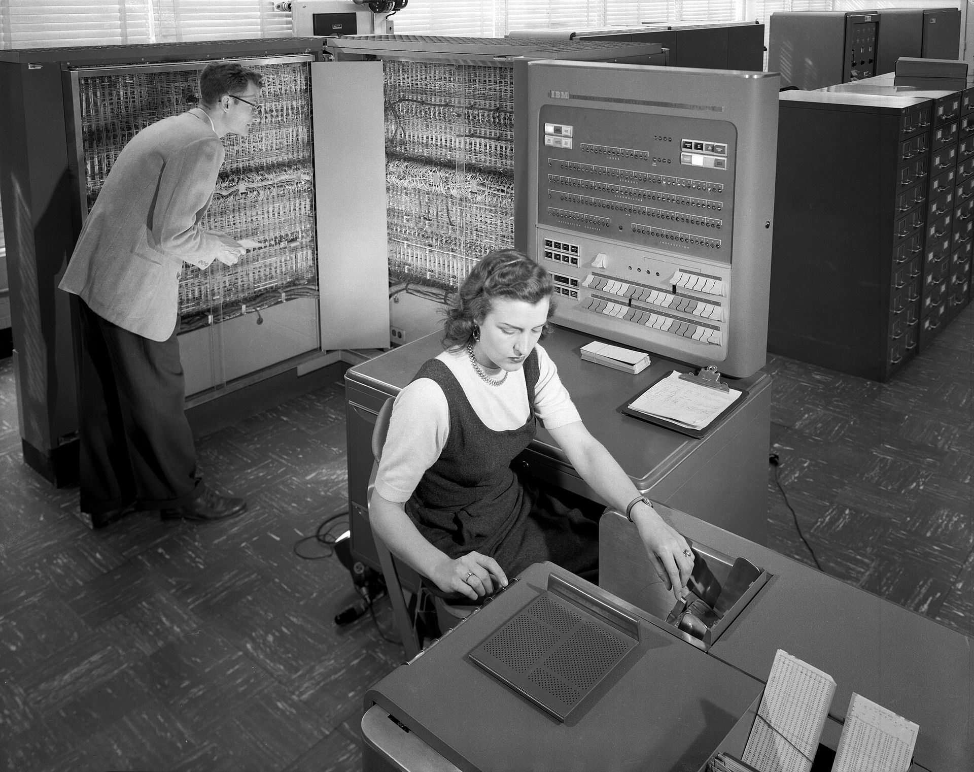 Two engineers working on an IBM Mainframe